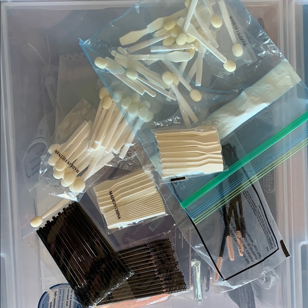 Assortment of disposable makeup application tools.